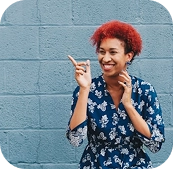 Person expressing joy in a public space.